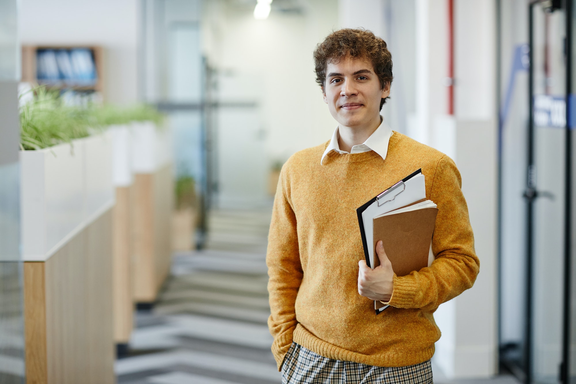 smiling-young-employee-in-office.jpg